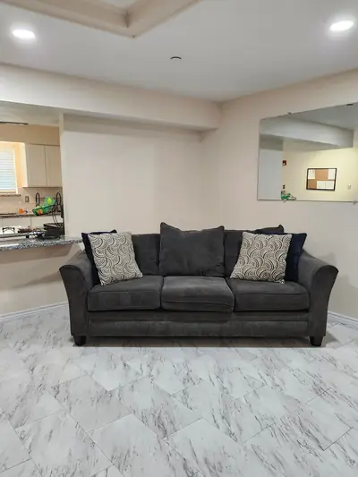 Bright living room with a comfortable sofa and pillows